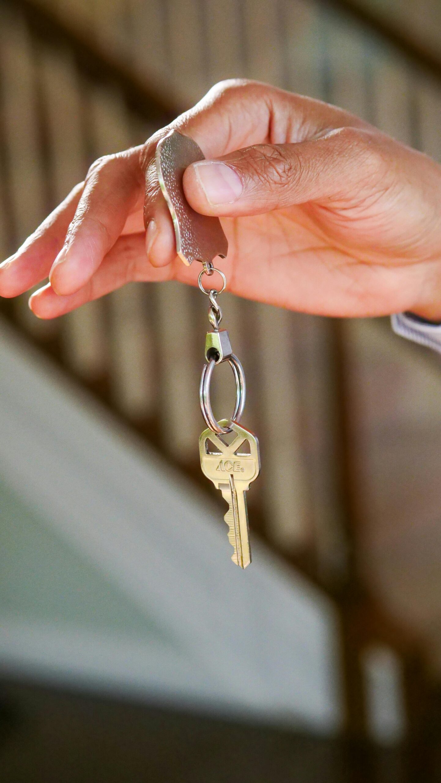 a hand holding a key chain