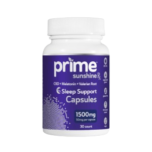 A bottle of Prime Sunshine Sleep Support Capsules. The bottle is white with a purple label. The label says "Prime Sunshine Sleep Support Capsules" and "CBD + Melatonin + Valerian Root." The bottle contains 30 capsules, with each capsule containing 1500mg.